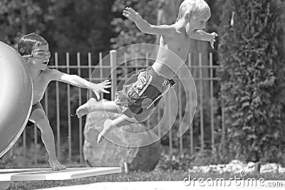 Boys Playing in the Pool Stock Photo