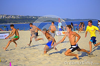 Boys racing on the beach Editorial Stock Photo