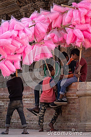 Boys Selling Cotton Candy in City Editorial Stock Photo