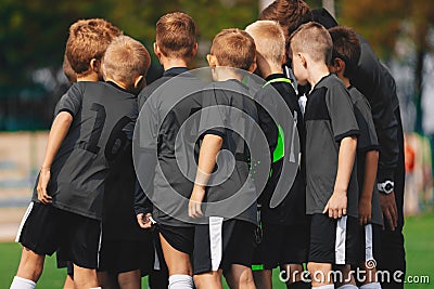 Boys Soccer Team in Huddle. Kids Sport Football Team Gathering with Coach on Sports Venue Editorial Stock Photo