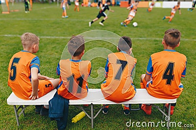 Boys Soccer Team Sitting on Bench. Kids Football Team Players. Soccer Tournament Match for Children Editorial Stock Photo