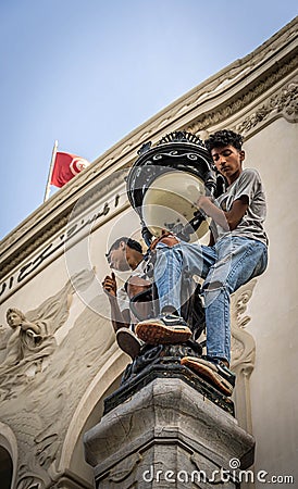 The boys on the street light during the pro-Palestine rally at Tunis. Editorial Stock Photo