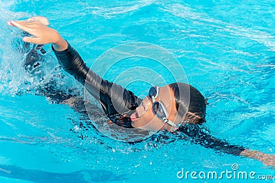 Boys are swimming in the pool Stock Photo