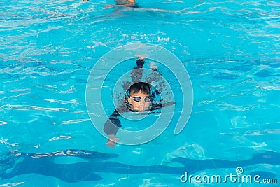 Boys are swimming in the pool Stock Photo