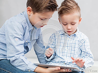 Boys with tablet pc Stock Photo