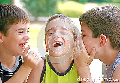 Boys Telling Secrets Stock Photo