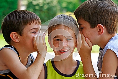 Boys Telling Secrets Stock Photo