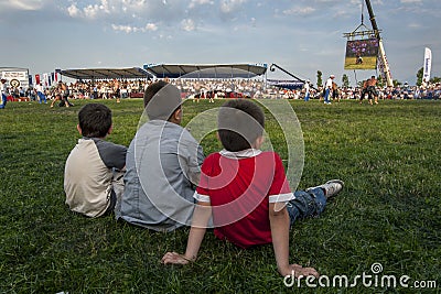 Boys watch the wrestling action at Izmit in Turkey. Editorial Stock Photo