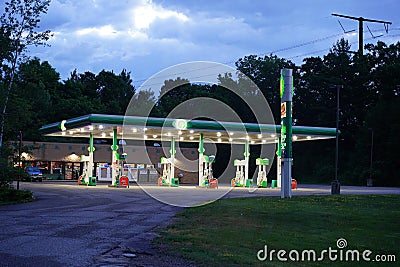 New Lisbon, Wisconsin USA - April 15th, 2022: BP fuel station glows at night servicing the community. Editorial Stock Photo