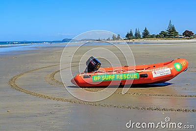 An inflatable surf rescue boat on a New Zealand beach Editorial Stock Photo