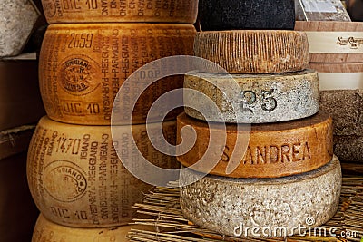 Wheels of hard cheese on the stall. Editorial Stock Photo