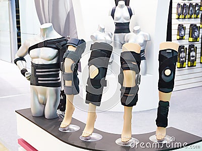 Brace on knee joint with sleeve made of neoprene in store Stock Photo