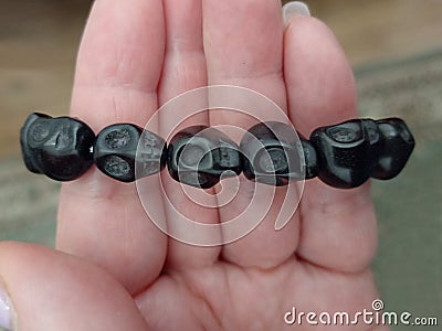 Black scull beads bracelet Lord Shiva worship close up Stock Photo