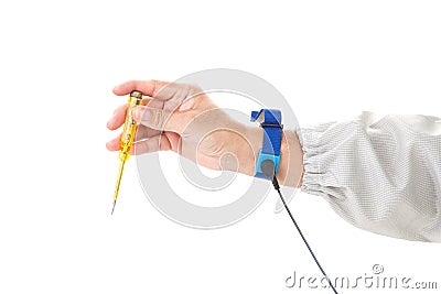 Bracelet on the hand of a man wearing ESD cloth holding a screwdriver, static resistance (ESD) bracelet or ground equipment, anti Stock Photo