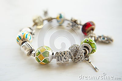 Bracelet with many accessories, luck, money, an owl Stock Photo