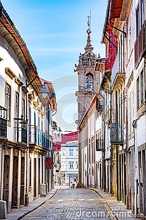 street scene in the old town of Braga with historic facades and people in early morning Editorial Stock Photo