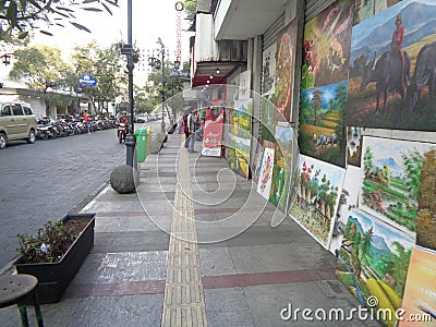 Braga street, pedestrian walk, parking area, element of pedestrian, painting is on display for sell Editorial Stock Photo