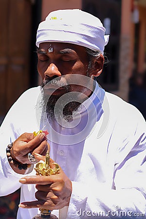 A brahmana in a trance state performs the ceremony. The religion of Hinduism on the island of Bali. Centuries-old Stock Photo