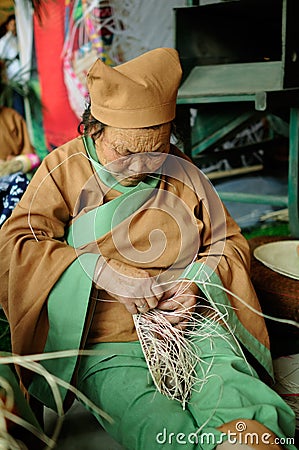 Braiding straw shoe,IFICH 2013 Editorial Stock Photo