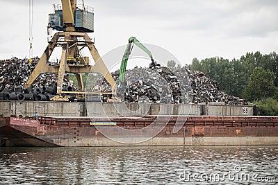 Metal scrapyard on the banks of the Danube river Editorial Stock Photo