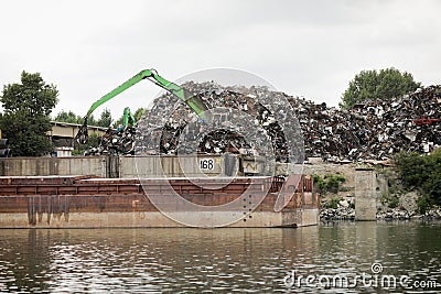 Metal scrapyard on the banks of the Danube river Editorial Stock Photo