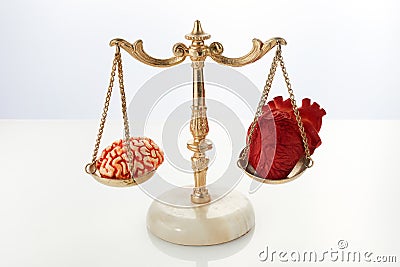 Brain and heart on scale balance on white background Stock Photo