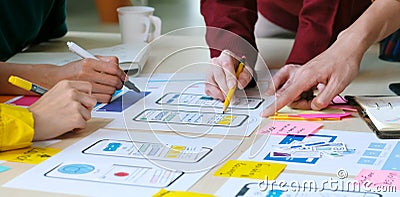 Brainstorm planing creative teamwork, Close up of hands mobile phone app developer team meeting about screen display prototype Stock Photo