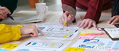 Brainstorm planing creative teamwork, Close up of hands mobile phone app developer team meeting about screen display prototype Stock Photo