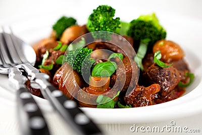 Braised beef with broccoli and mushrooms Stock Photo