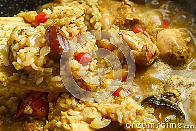 Braised eggplants with meat and rice in Israeli spices in a cast-iron high frying pan close-up. Stock Photo