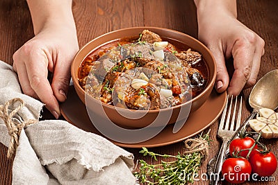 Braised meat with vegetables in a thick sauce Stock Photo
