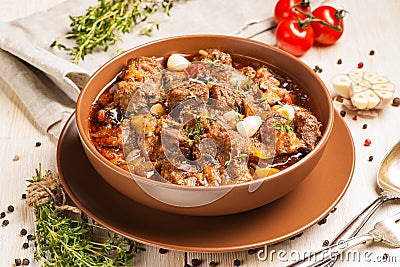 Braised meat with vegetables in a thick sauce Stock Photo