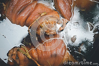 Braised pork leg with boiling sweet gravy sauce in a big pot Stock Photo