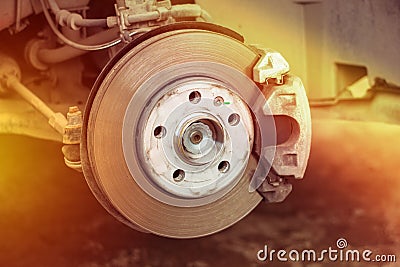 Brake disc and wheel hub parts with light, concept of brake problems Stock Photo