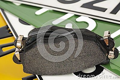 Brake pads and license plates Stock Photo