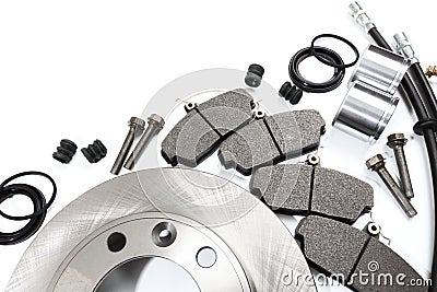 Brake parts on white: brake pads, disc, brake hose, guides, cylinders Stock Photo