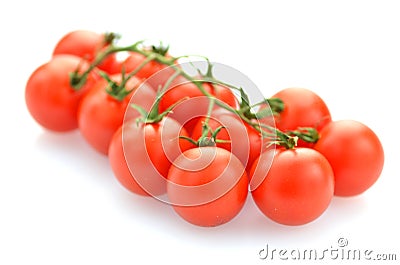 Branch of fresh cherry tomatoes isolated on white Stock Photo