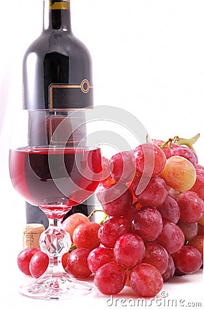 Branch of grapes, bottle of wine and glass Stock Photo