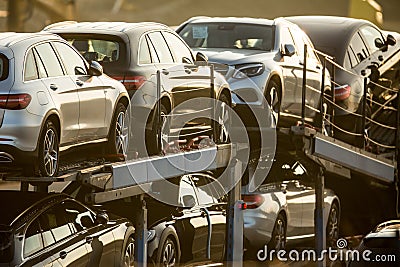 Brand new cars being transported on a truck Stock Photo