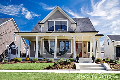 Brand New Custom Home with a Large Front Porch and Beautiful Landscaping Stock Photo