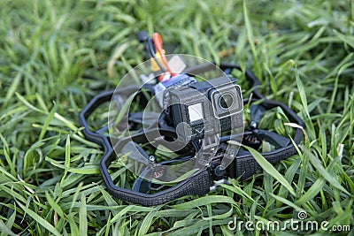 A Brand-New Modern Cinewhoop Iflight Protek 35 with GoPro Action Camera on Board Outdoors in the Grass Stock Photo