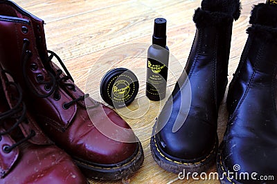Branded Dr Martens shoe care protector kit. Leather wax and all weather protection spray. Editorial Stock Photo