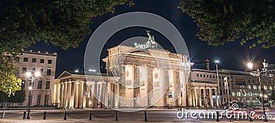 Brandenburg Gate at night with a treetop as a frame Stock Photo