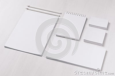 Branding business mock up of white blank stationery set on light soft white wooden background, inclined. Stock Photo