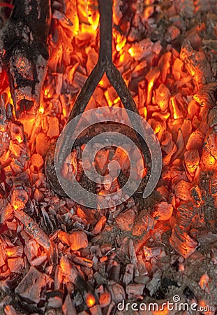 Branding iron for cattle over embers Stock Photo