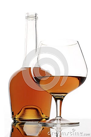 Brandy glass and bottle Stock Photo