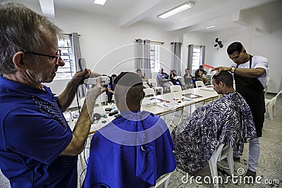 Brasil - San Paolo - The ONG Sermig - free barber for homeless Editorial Stock Photo