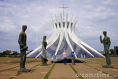 BRASILIA, BRAZIL - AUGUST 30, 2023: Cathedral of Brasilia with three Evangelists sculptures in foreground , Brazil Editorial Stock Photo