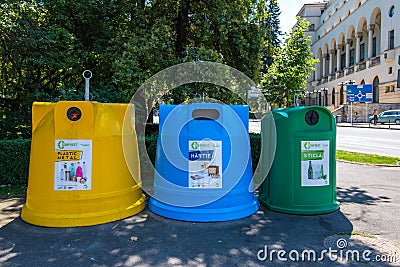 Trash cans for separated collections on the city streets. Editorial Stock Photo