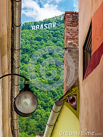 Brasov/Romania - 06.28.2020: Brasov written with big letters on Mount Tampa. Brasov sign seen from the narrow streets of the old Editorial Stock Photo